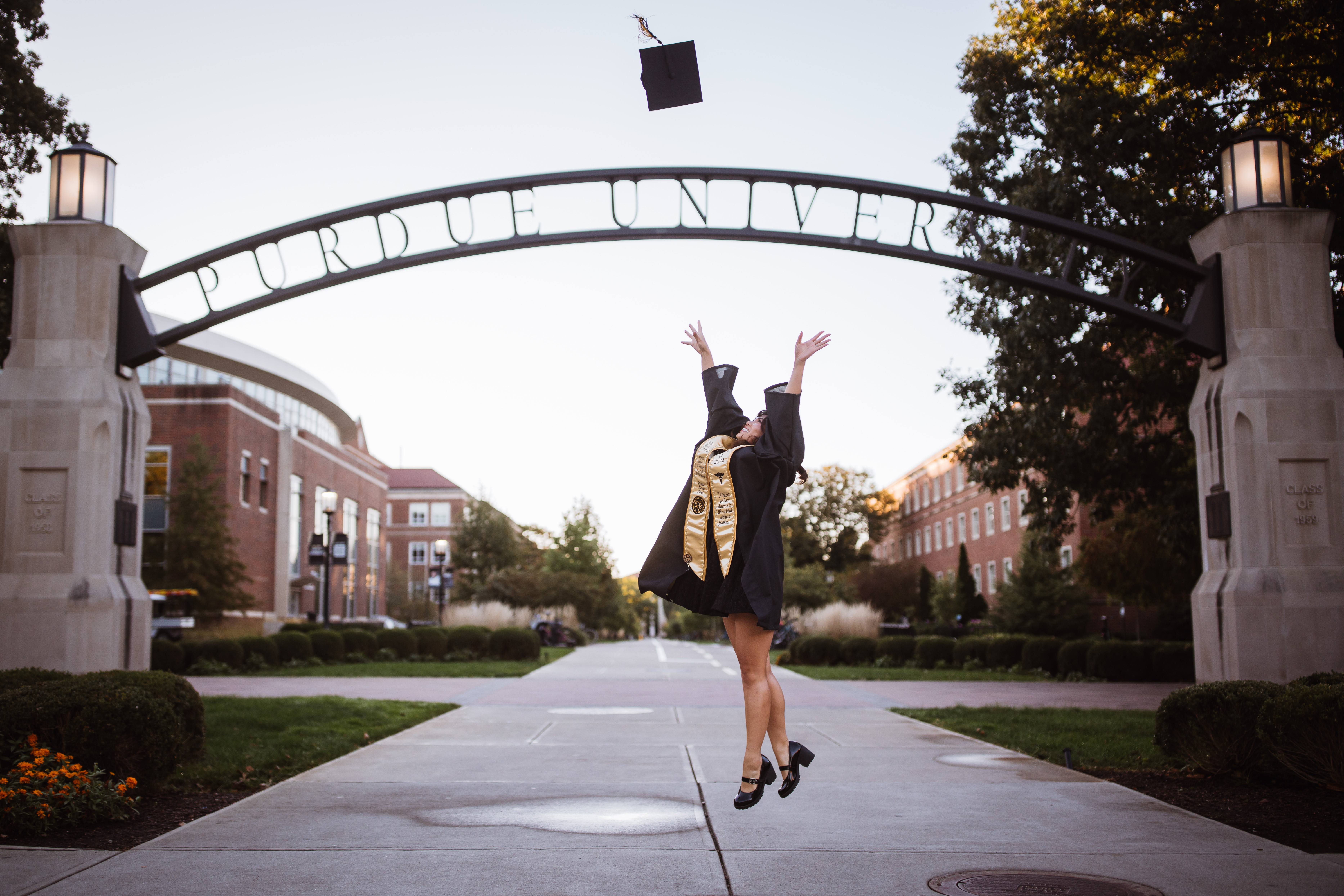 Lafayette senior photographer - graduate tossing cap at Purdue University